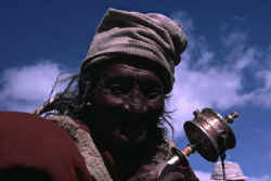 Man with prayer wheel.JPG (28804 bytes)